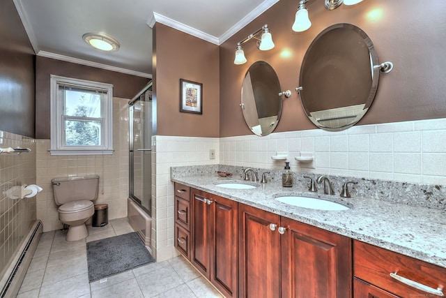 17 Farmstead Ln, West Hartford, CT 06117 - full bath featuring a baseboard radiator, tile walls, tile patterned floors, crown molding, and double vanity