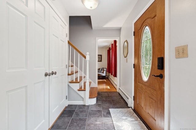 43 Debi Cir, Colchester, CT 06415 - entrance foyer featuring a baseboard heating unit, stairway, a baseboard radiator, dark tile patterned floors, and baseboards