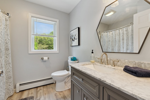43 Debi Cir, Colchester, CT 06415 - full bath featuring baseboard heating, vanity, wood finished floors, toilet, and baseboards
