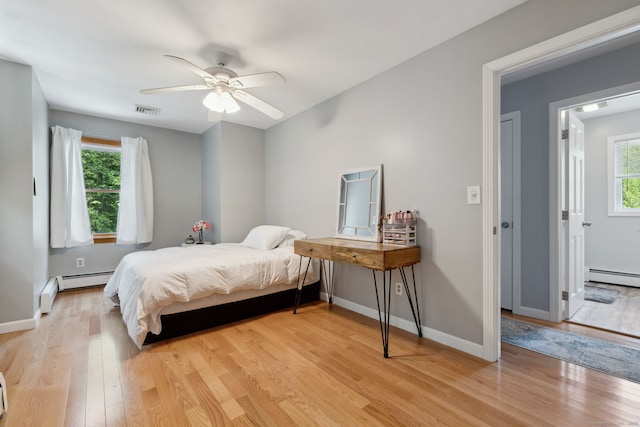 43 Debi Cir, Colchester, CT 06415 - bedroom with light wood finished floors, baseboard heating, and baseboards