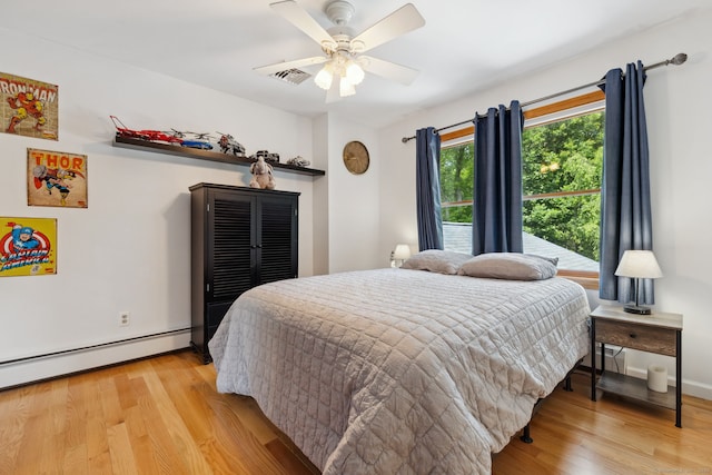 43 Debi Cir, Colchester, CT 06415 - bedroom with wood finished floors, a baseboard radiator, and a ceiling fan