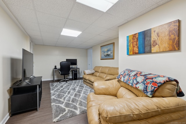 43 Debi Cir, Colchester, CT 06415 - living area with wood finished floors, a paneled ceiling, a desk, and baseboards