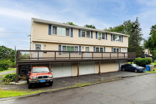 39 Mechanic St, Bristol, CT 06010 - view of front of property with an attached garage, driveway, and a wooden deck