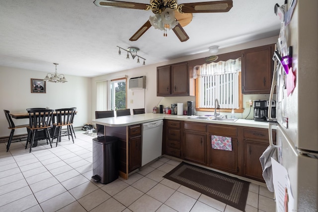 39 Mechanic St, Bristol, CT 06010 - kitchen with white appliances, a peninsula, a wall mounted air conditioner, and light countertops