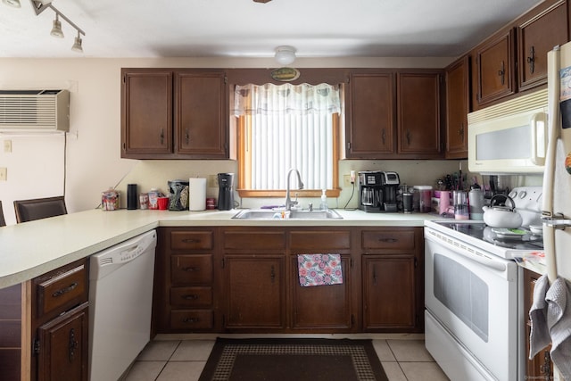 39 Mechanic St, Bristol, CT 06010 - kitchen with white appliances, a wall mounted air conditioner, a peninsula, light tile patterned flooring, and light countertops