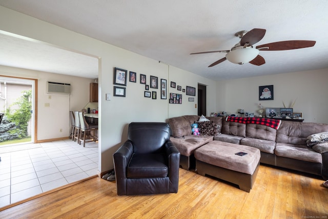 39 Mechanic St, Bristol, CT 06010 - living room with an AC wall unit, ceiling fan, and light wood-style floors