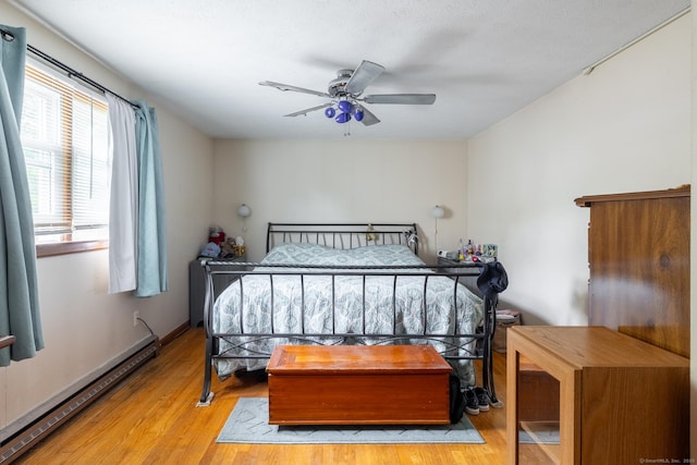 39 Mechanic St, Bristol, CT 06010 - bedroom featuring baseboard heating, wood finished floors, and ceiling fan