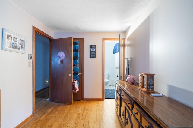 39 Mechanic St, Bristol, CT 06010 - hall with light wood-style floors and a textured ceiling
