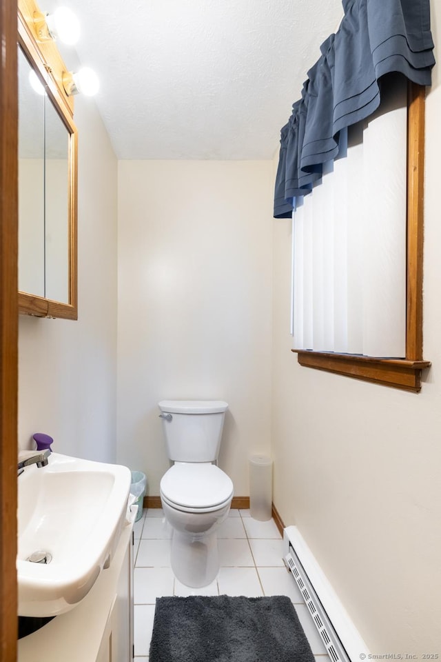39 Mechanic St, Bristol, CT 06010 - bathroom featuring baseboard heating, tile patterned flooring, and vanity