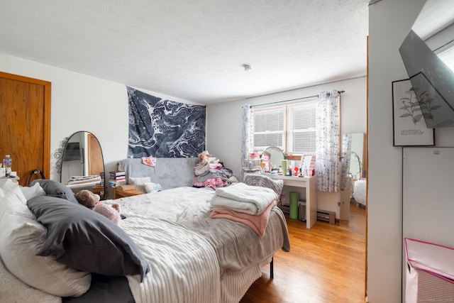 39 Mechanic St, Bristol, CT 06010 - bedroom featuring wood finished floors and a textured ceiling