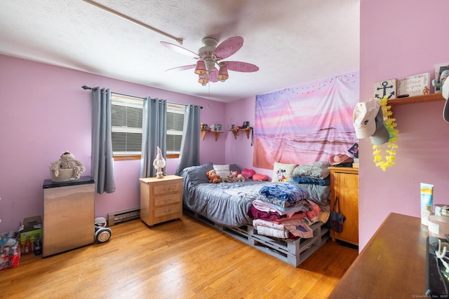 39 Mechanic St, Bristol, CT 06010 - bedroom featuring wood finished floors, baseboard heating, a textured ceiling, and ceiling fan
