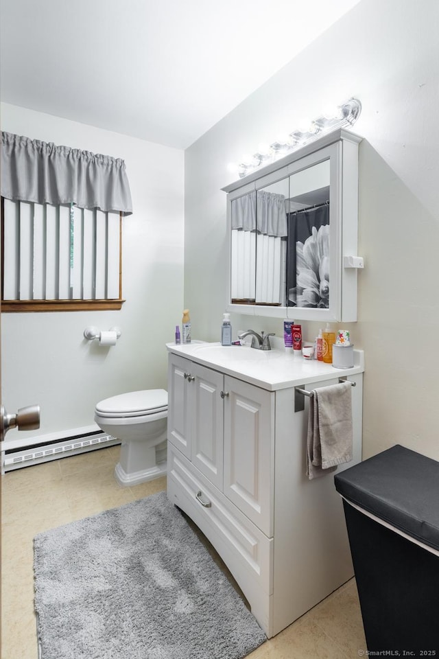 39 Mechanic St, Bristol, CT 06010 - bathroom featuring a baseboard heating unit, vanity, and tile patterned floors