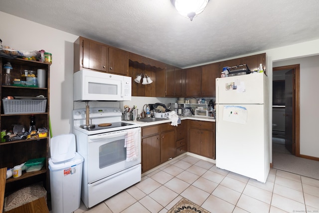 39 Mechanic St, Bristol, CT 06010 - kitchen featuring white appliances, light countertops, and light tile patterned floors