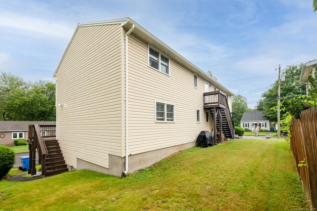 39 Mechanic St, Bristol, CT 06010 - rear view of property with stairway, a yard, and a wooden deck