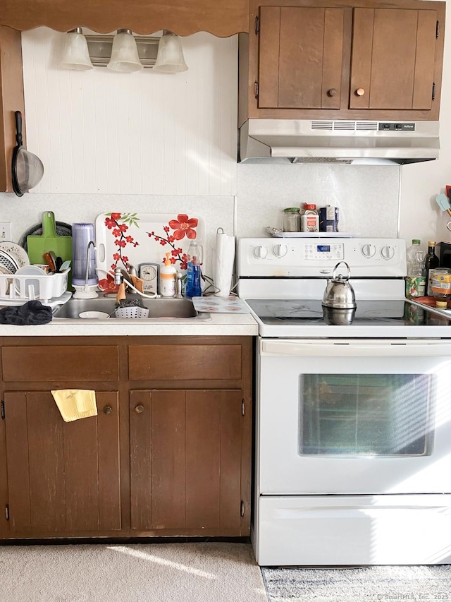 39 Mechanic St, Bristol, CT 06010 - kitchen with white electric range, under cabinet range hood, and light countertops