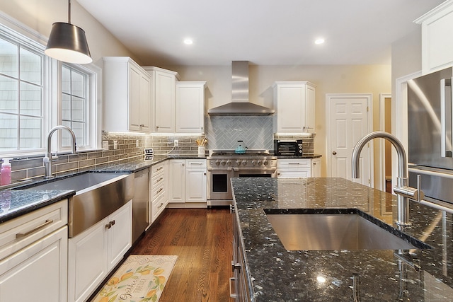 11 Delno Dr, Danbury, CT 06811 - kitchen with wall chimney exhaust hood, appliances with stainless steel finishes, a sink, white cabinetry, and recessed lighting