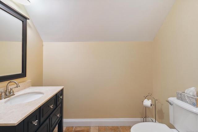 11 Delno Dr, Danbury, CT 06811 - bathroom featuring toilet, vaulted ceiling, vanity, and baseboards