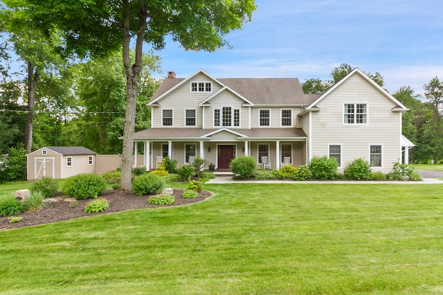 11 Delno Dr, Danbury, CT 06811 - view of front of property featuring a chimney, a shingled roof, covered porch, and a front lawn