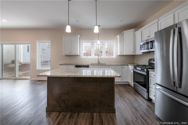 22 Lombard Cir Unit 22, North Haven, CT 06473 - kitchen featuring stainless steel appliances, dark wood-style floors, a center island, tasteful backsplash, and recessed lighting