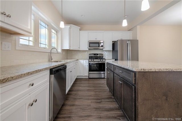 22 Lombard Cir Unit 22, North Haven, CT 06473 - kitchen featuring appliances with stainless steel finishes, white cabinets, and tasteful backsplash