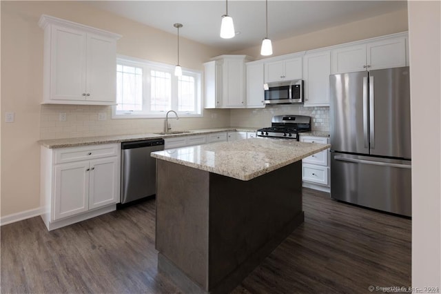 22 Lombard Cir Unit 22, North Haven, CT 06473 - kitchen with appliances with stainless steel finishes, dark wood finished floors, white cabinets, and tasteful backsplash