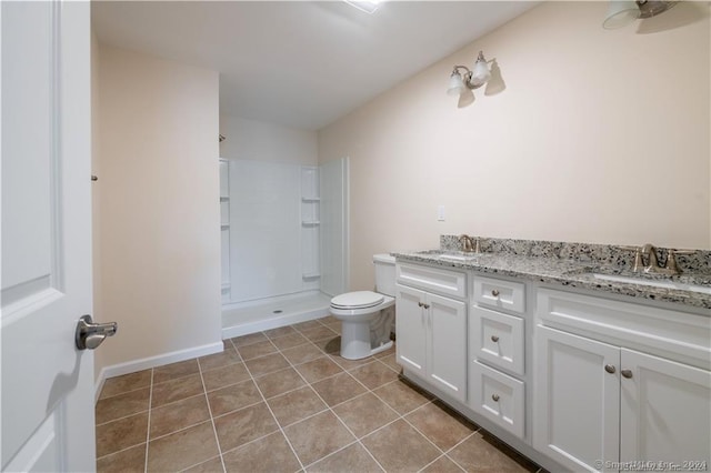 22 Lombard Cir Unit 22, North Haven, CT 06473 - bathroom featuring a shower stall, double vanity, and tile patterned flooring
