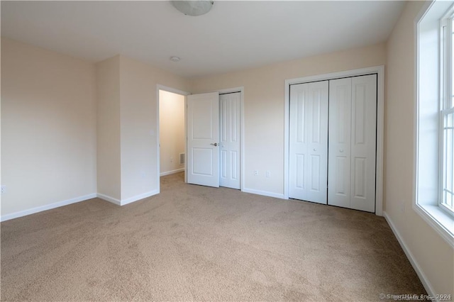 22 Lombard Cir Unit 22, North Haven, CT 06473 - unfurnished bedroom with carpet flooring and two closets