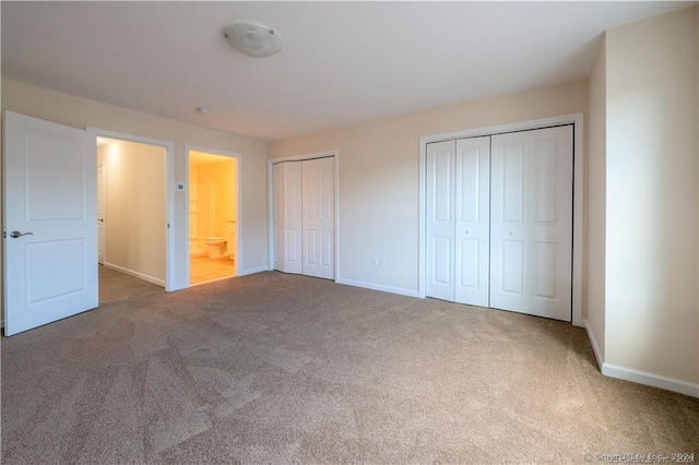22 Lombard Cir Unit 22, North Haven, CT 06473 - unfurnished bedroom with multiple closets and carpet flooring