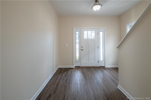 22 Lombard Cir Unit 22, North Haven, CT 06473 - foyer entrance featuring dark wood finished floors and baseboards
