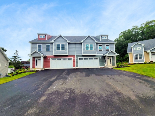 20 Lombard Cir Unit 20, North Haven, CT 06473 - view of property with a garage, driveway, and a front lawn