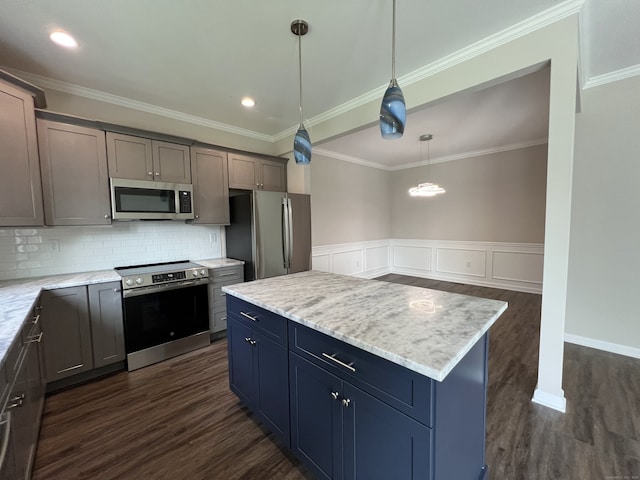 20 Lombard Cir Unit 20, North Haven, CT 06473 - kitchen featuring appliances with stainless steel finishes, decorative backsplash, dark wood finished floors, pendant lighting, and wainscoting