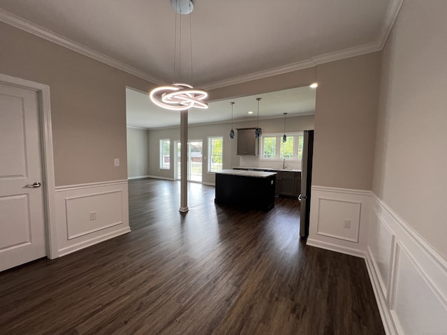 20 Lombard Cir Unit 20, North Haven, CT 06473 - unfurnished dining area with dark wood-type flooring, a chandelier, wainscoting, ornamental molding, and a decorative wall