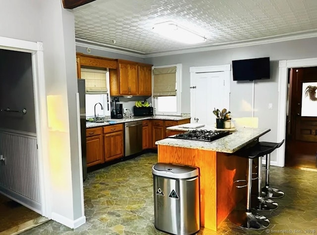 92 Curtiss St, Naugatuck, CT 06770 - kitchen with dishwasher, a breakfast bar, a center island, dark stone finish flooring, and crown molding