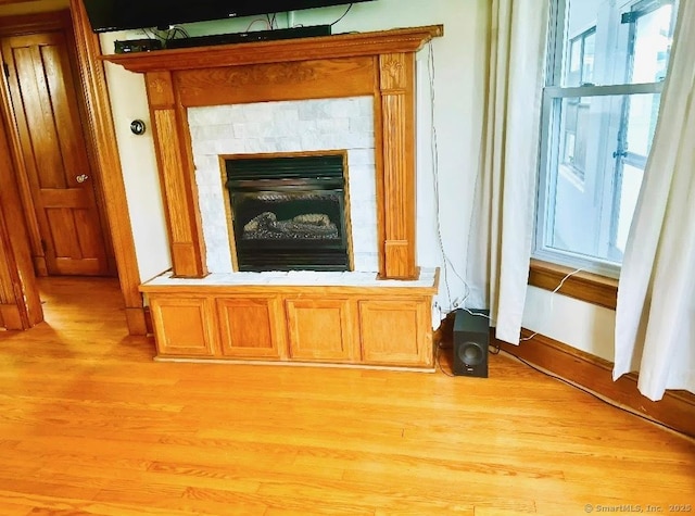 92 Curtiss St, Naugatuck, CT 06770 - detailed view of wood finished floors and a fireplace