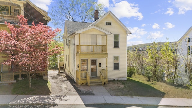 480 W St, Bristol, CT 06010 - view of front facade featuring a balcony, a chimney, and roof with shingles