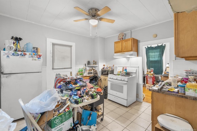 480 W St, Bristol, CT 06010 - kitchen with white appliances, under cabinet range hood, light tile patterned floors, ceiling fan, and ornamental molding