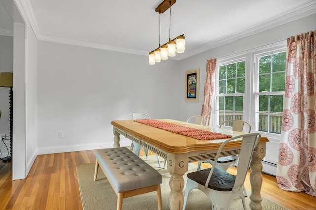 19 W Hills Rd, Essex, CT 06442 - dining space with ornamental molding, light wood-style floors, and baseboard heating