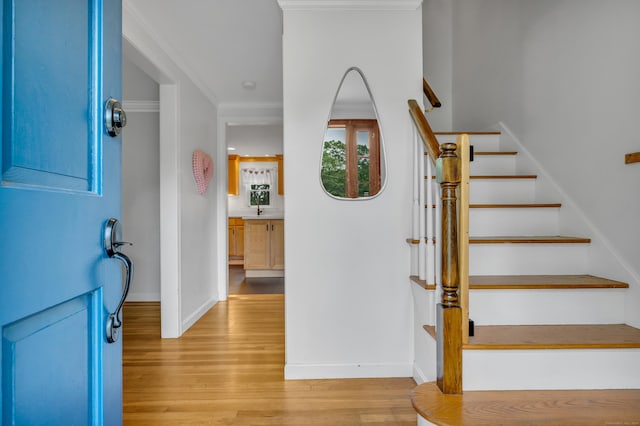 19 W Hills Rd, Essex, CT 06442 - stairs with wood finished floors and crown molding