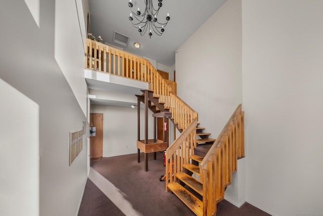 30 Riverview Dr Unit 30, Bridgeport, CT 06606 - stairway featuring a towering ceiling, carpet flooring, a chandelier, and baseboards