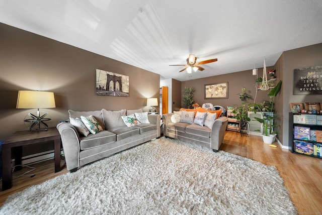 30 Riverview Dr Unit 30, Bridgeport, CT 06606 - living area featuring a ceiling fan, wood finished floors, a baseboard radiator, and baseboards
