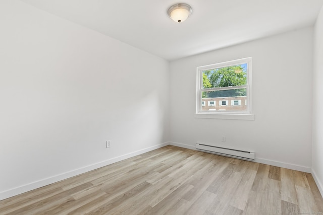 17 Avon Ln, Stamford, CT 06907 - spare room featuring a baseboard heating unit, light wood-style flooring, and baseboards