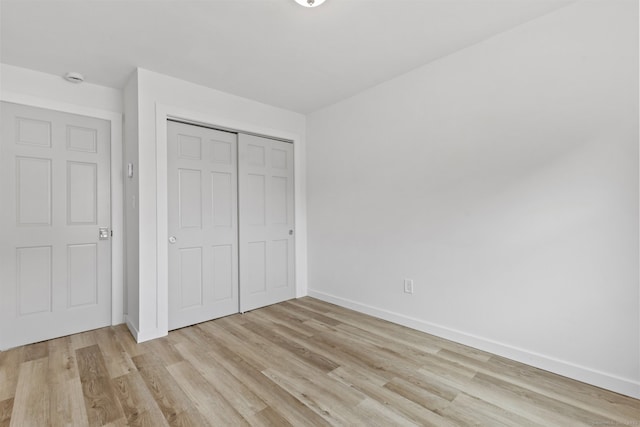 17 Avon Ln, Stamford, CT 06907 - unfurnished bedroom featuring light wood-type flooring, baseboards, and a closet
