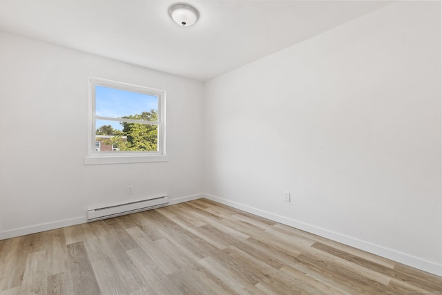 17 Avon Ln, Stamford, CT 06907 - empty room featuring a baseboard heating unit, light wood-type flooring, and baseboards
