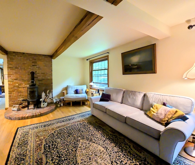 44 Wilbur Rd, Washington, CT 06777 - living room with beam ceiling, wood finished floors, and a wood stove