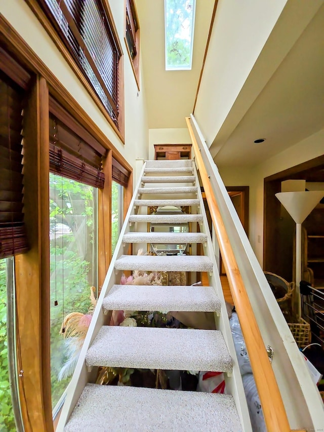 44 Wilbur Rd, Washington, CT 06777 - stairway with healthy amount of natural light, a skylight, and a high ceiling