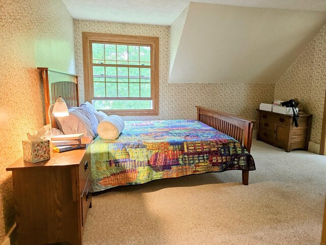 44 Wilbur Rd, Washington, CT 06777 - bedroom with wallpapered walls, carpet, and lofted ceiling