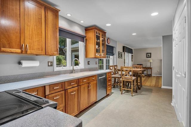 35 Whitethorn Dr, Guilford, CT 06437 - kitchen featuring dishwasher, a sink, brown cabinetry, recessed lighting, and light countertops