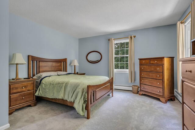 35 Whitethorn Dr, Guilford, CT 06437 - bedroom featuring light colored carpet, baseboard heating, and a textured ceiling