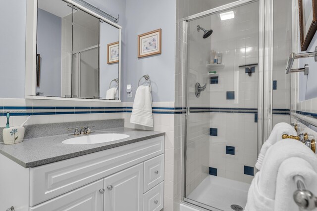 35 Whitethorn Dr, Guilford, CT 06437 - full bathroom with a stall shower, vanity, and tile walls