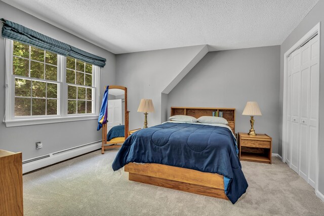 35 Whitethorn Dr, Guilford, CT 06437 - carpeted bedroom with a baseboard radiator, a closet, a textured ceiling, and baseboards